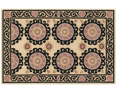 Handcrafted wool Medallion Rug featuring black border and ornate circles.