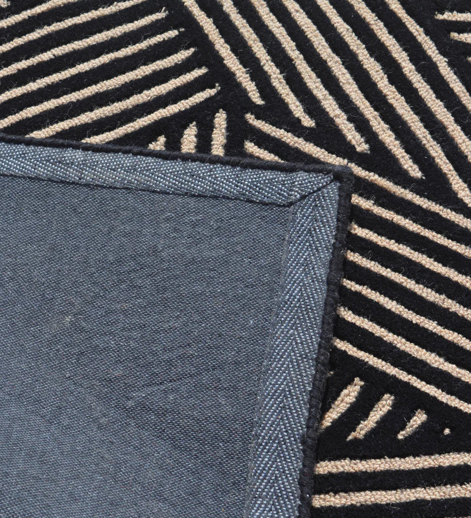 Designer hand-tufted area rug with abstract beige line detailing.