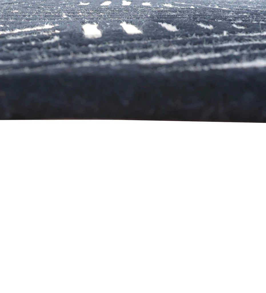 Contemporary wool rug in beige and black for modern living rooms.