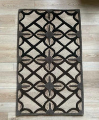 Contemporary hand-tufted wool rug with circular accents.