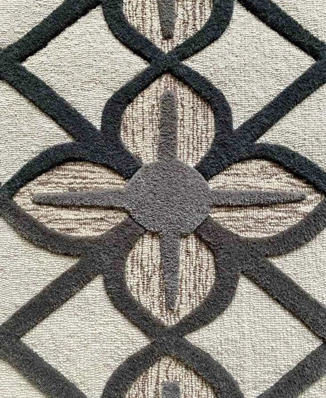 Neutral beige and black geometric rug for modern interiors.