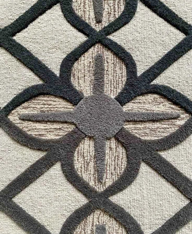 Neutral beige and black geometric rug for modern interiors.