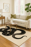 Hand-tufted wool rug with snake pattern by Mannat Rugs.