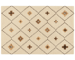 Boho geometric wool rug with beige and tan diamond pattern.