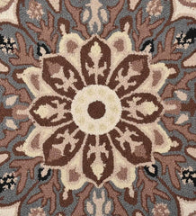 Classic beige and brown wool rug with blue border details