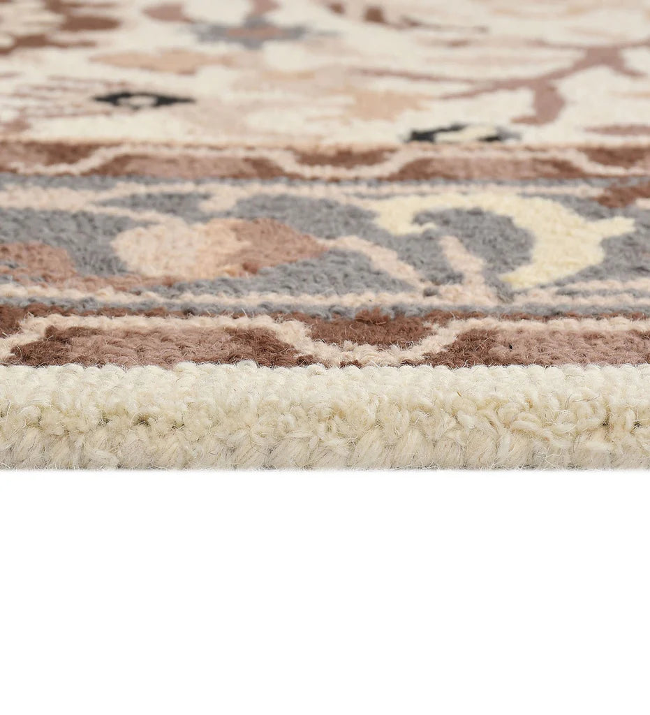 Heritage-inspired wool rug with beige, cream, and brown tones