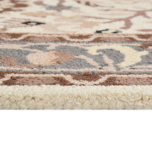 Heritage-inspired wool rug with beige, cream, and brown tones