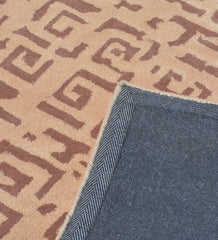 Hand-tufted geometric rug in earthy beige and brown tones