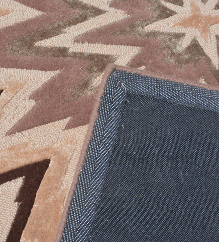 Contemporary hand-tufted rug with bold zigzag star motif