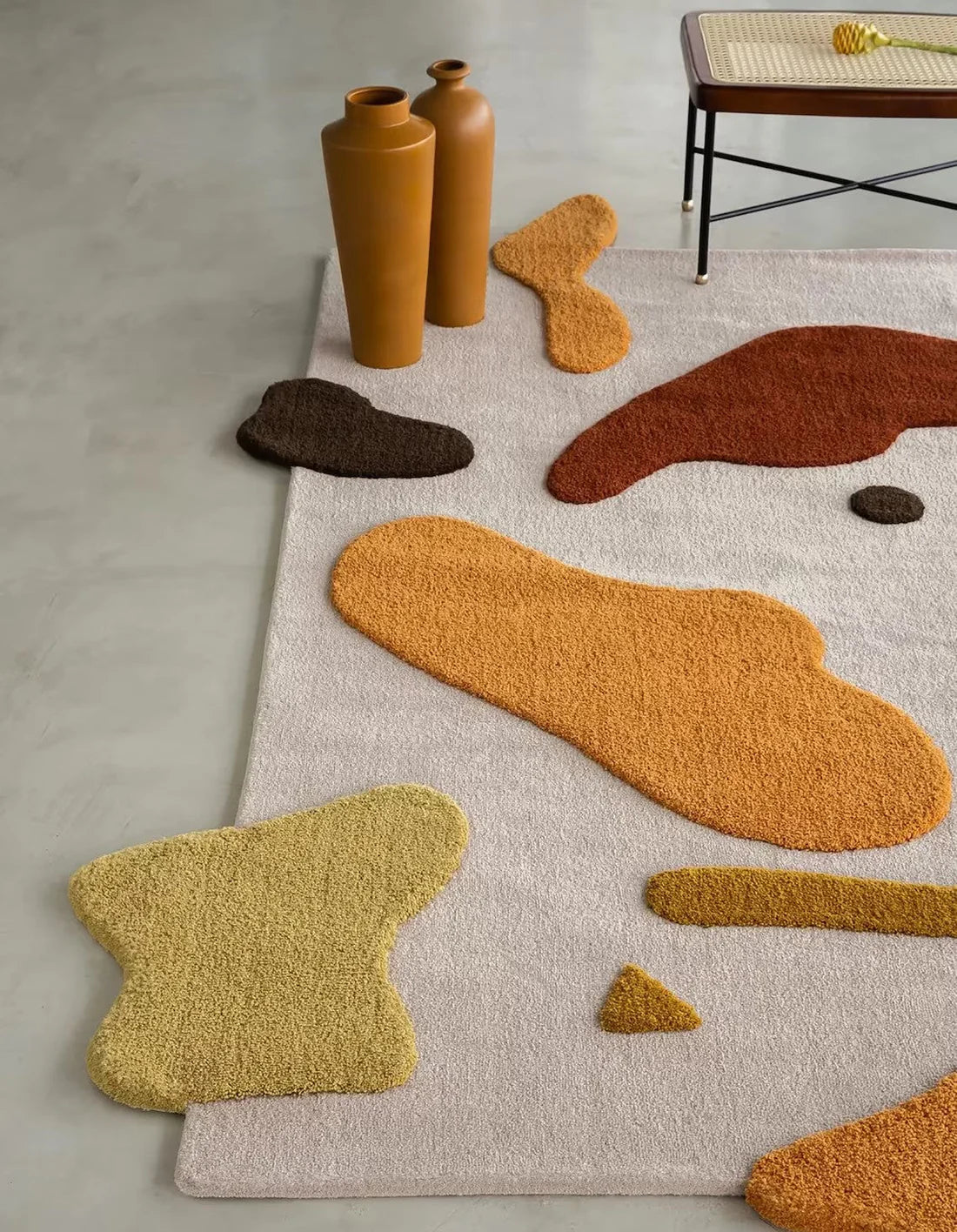 Handcrafted wool rug in earthy beige and mustard tones.