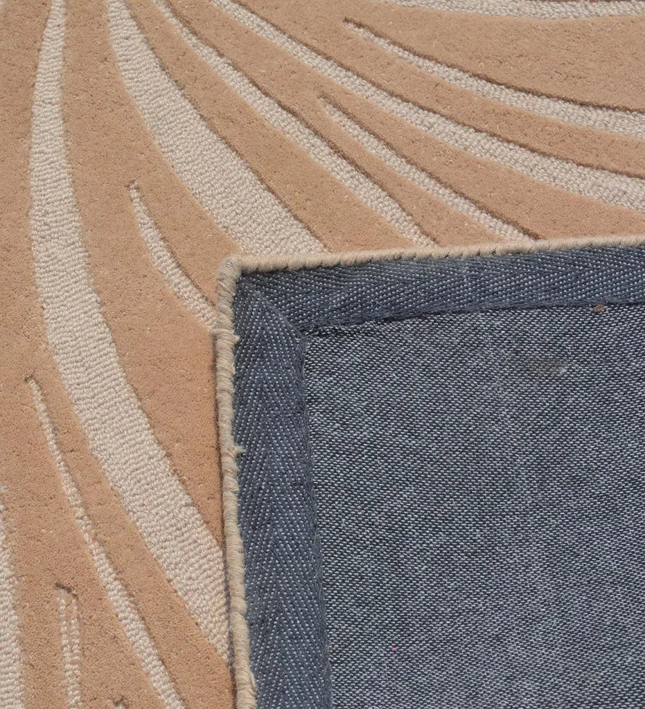 Hand-tufted rug featuring abstract botanical design