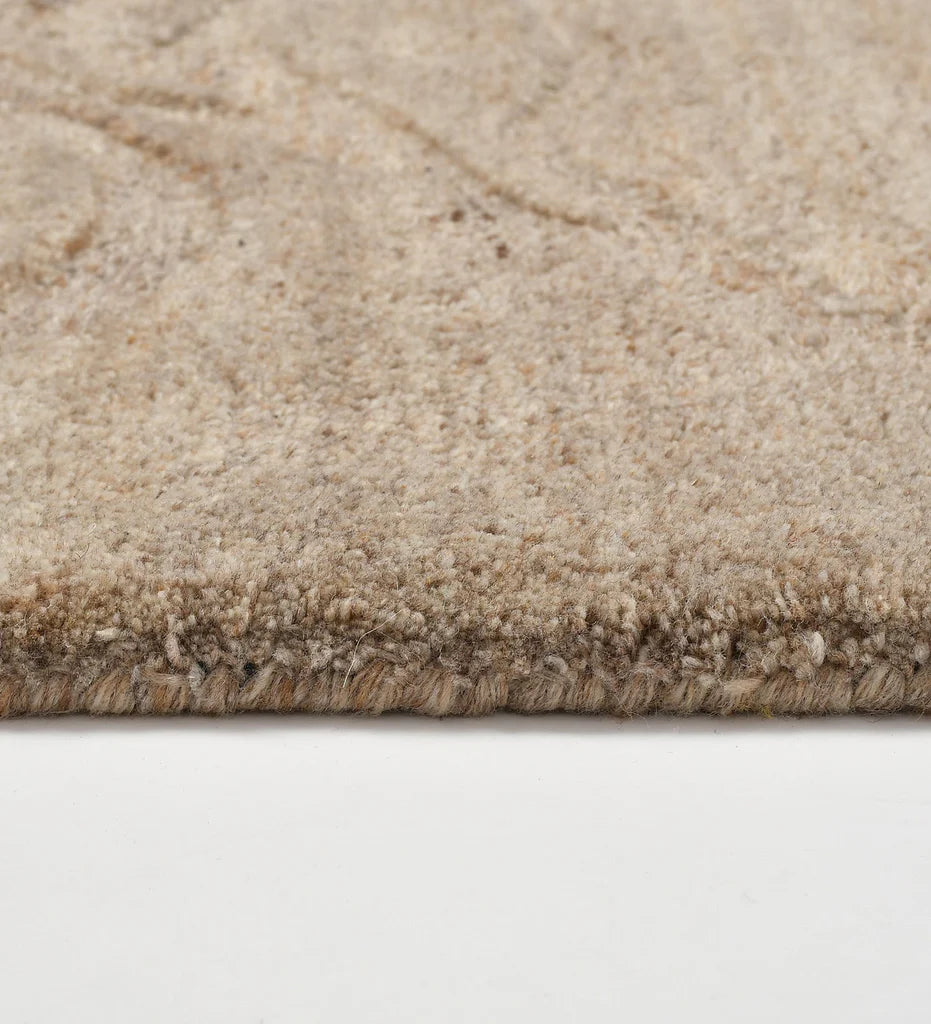 Premium wool rug in taupe tones with modern wave texture