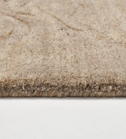 Premium wool rug in taupe tones with modern wave texture