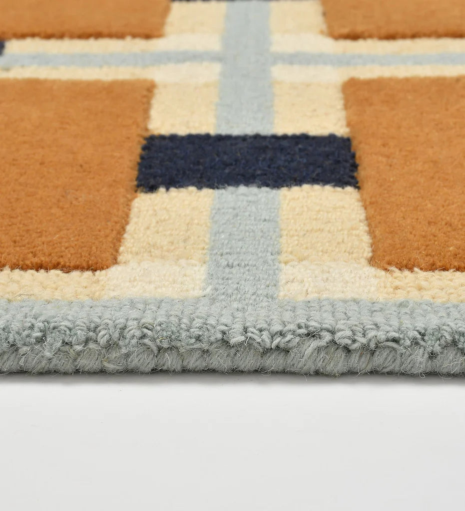 Contemporary hand-tufted rug with orange square motif