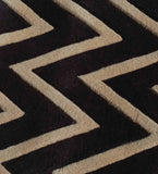 Close-up of a luxury beige and brown hand-tufted runner rug with geometric zigzag pattern