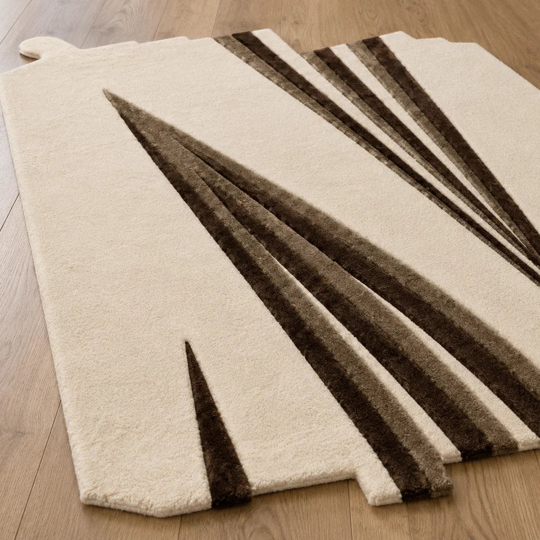 Beige rug with brown geometric pattern on a wooden floor