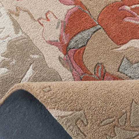 Artistic floral abstract rug with beige, blush, and gray tones.