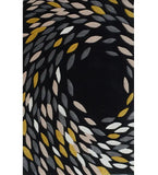 Luxury black wool rug with handwoven abstract leaf pattern in gray, beige, white, and mustard colors