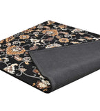 Heritage-inspired wool rug with ornate floral vine design
