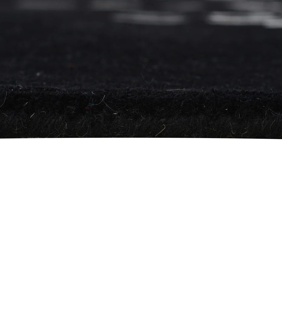 Abstract modern wool rug in black with white and grey accents