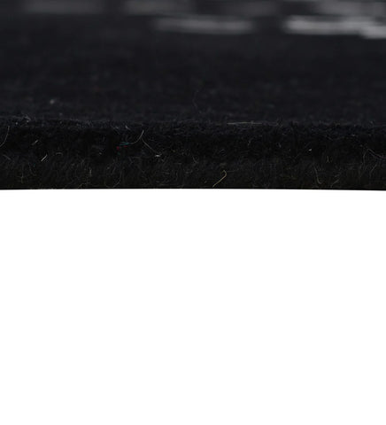 Abstract modern wool rug in black with white and grey accents