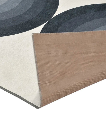 Durable modern rug with black and gray geometric arch motif.
