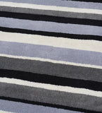 Hand-tufted wool area rug with modern monochrome stripe design.