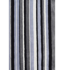 Black, gray, and blue hand-tufted wool rug with vertical striped pattern.