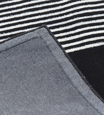 Minimalist geometric rug with clean lines and modern style.