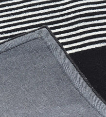 Minimalist geometric rug with clean lines and modern style.