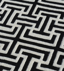 Luxury hand-tufted wool rug in black and white geometric style