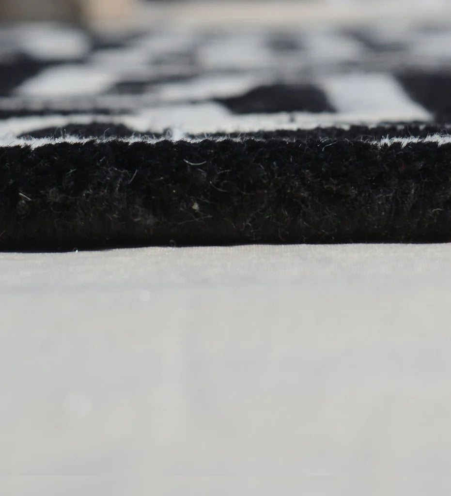Minimalist geometric wool rug with maze-like design