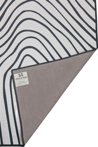 Minimalist black and white abstract rug for living rooms.