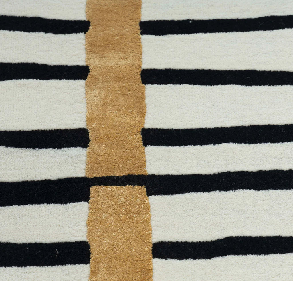 Contemporary monochrome wool rug with geometric stripe design.