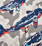 Close-up of luxury handwoven rug featuring blue and coral koi fish on a beige and gray abstract background