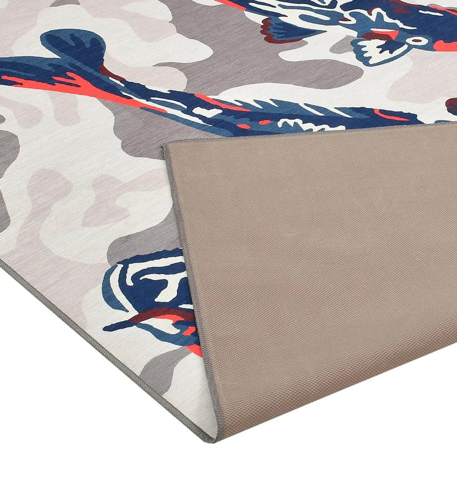 Coastal-themed blue rug with fish design.