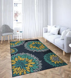 Modern living room with parquet floor featuring a blue floral patterned rug from Mannat Rugs