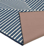 Blue modern geometric rug with white linear pattern and brown textured backing, luxury handwoven design