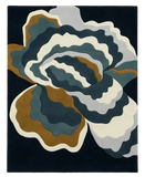 Handwoven luxury rug with abstract layered floral design in blue, gray, brown, and cream colors
