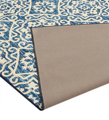Blue Moroccan style rug with intricate geometric and floral patterns, corner flipped