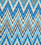 Handwoven luxury rug with blue pixelated chevron pattern, geometric design for stylish home decor