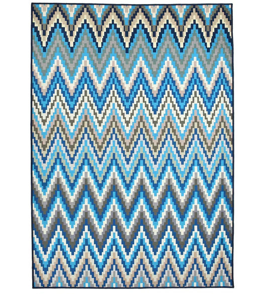 Blue pixelated chevron pattern rug for modern interiors.