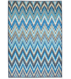 Blue pixelated chevron pattern rug with shades of blue, gray, and white, handwoven luxury design