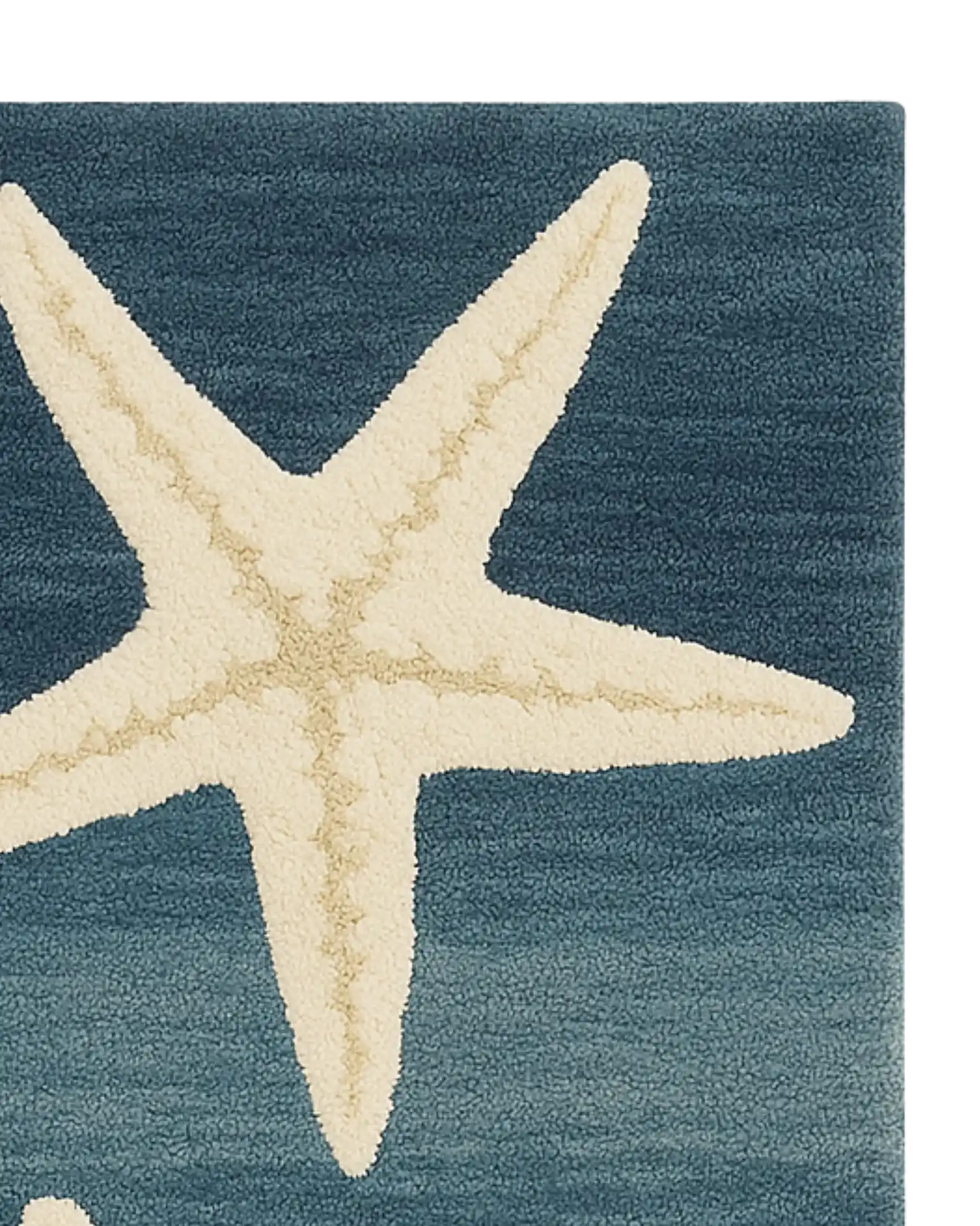 Modern coastal rug with cream starfish motifs on blue background