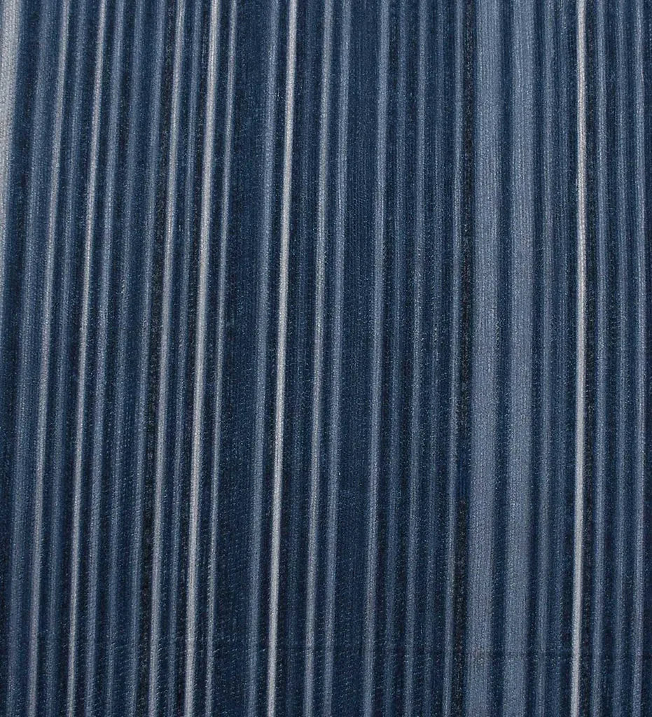 Coastal style rug featuring blue stripe pattern.