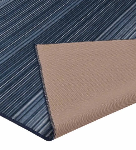 Washable rug with alternating blue stripe design.