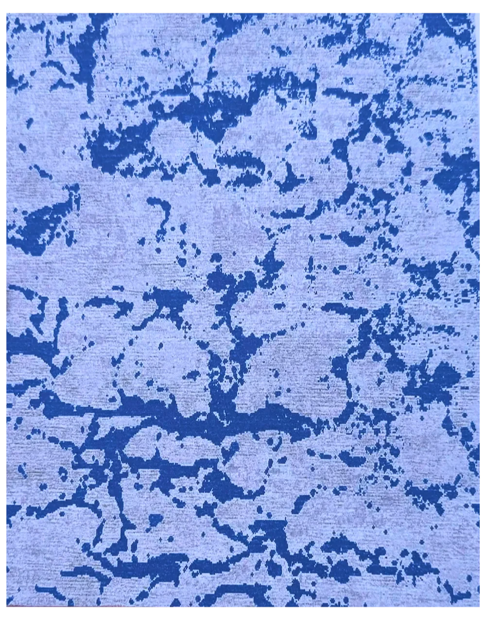 Hand-knotted blue and beige abstract wool rug with pixel pattern.