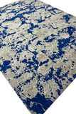 Blue and beige abstract pixel pattern wool rug with modern textured design
