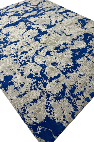 Luxury modern rug with bold blue and beige design.