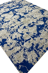 Luxury modern rug with bold blue and beige design.